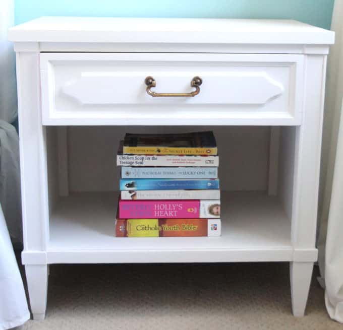 Thrift store score bedside table painted white with a fun surprise inside the drawer!