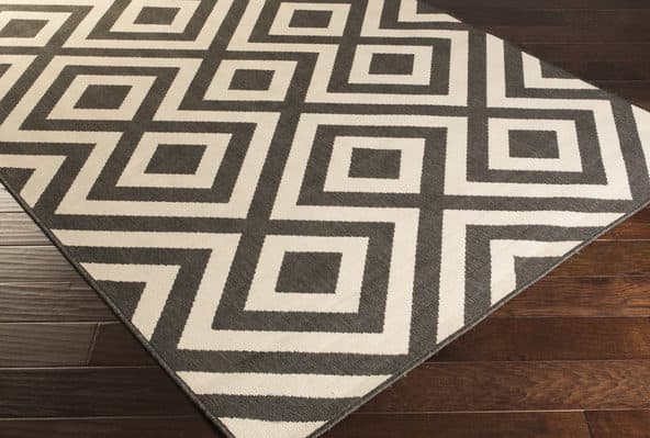 Rug runners for stairs - this black and natural geometric indoor outdoor runner would bring a fun punch to a set of stairs!