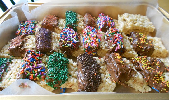 Rice Krispy treats are made a little more special with the addition of melted chocolate and sprinkles.