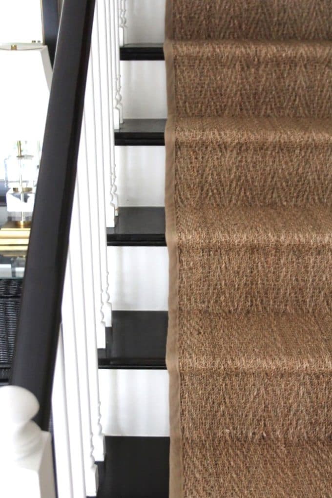 DIY installation of a seagrass runner completes a stair makeover in an 80s era colonial.