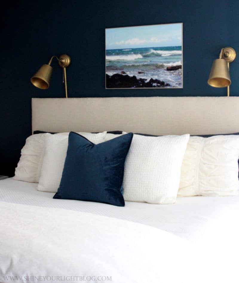 Navy and white master bedroom with layers for fall.