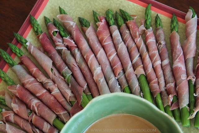 Prosciutto wrapped asparagus with wasabi dipping sauce makes a simple and delicious holiday appetizer.
