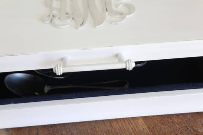 An old wooden silverware or jewelry box can be relined and made useful once again.