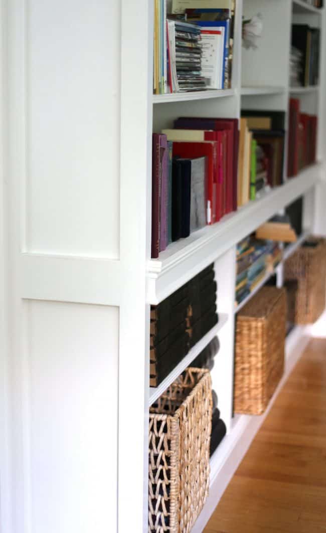 Use large baskets to give weight to a bookcase when styling.